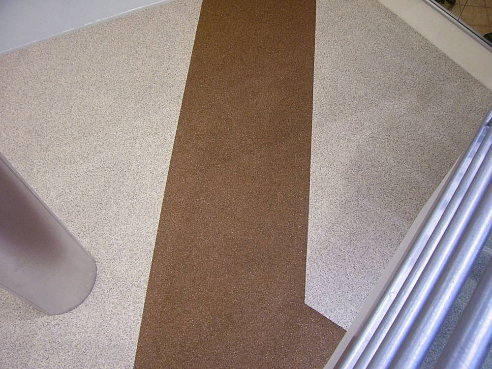 Two colors of stone were used to lead patrons into the health club.